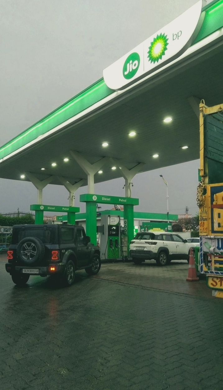 Staff serving customers at fuel station